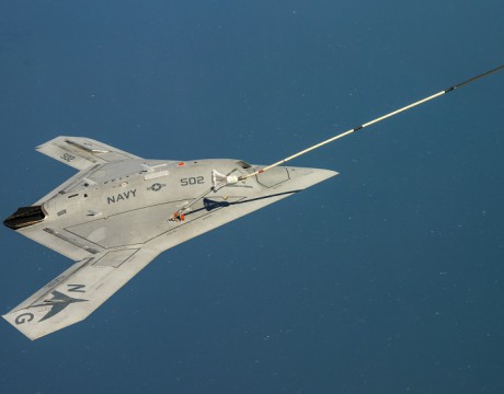 150422-N-CE233-377 PATUXENT RIVER, Md. (April 22, 2015) The Navy's unmanned X-47B receives fuel from an Omega K-707 tanker while operating in the Atlantic Test Ranges over the Chesapeake Bay. This test marked the first time an unmanned aircraft refueled in flight. (U.S. Navy photo/Released)