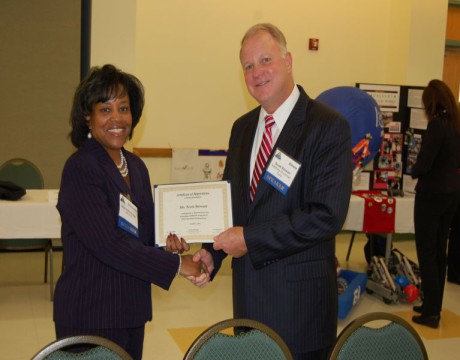 Scott Stewart receives STEM award from Sharmella Riggs NAVAIR