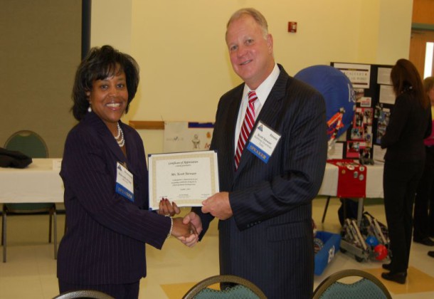 Scott Stewart receives STEM award from Sharmella Riggs NAVAIR